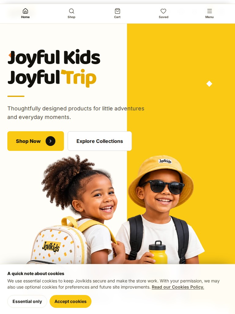 Jovikids website homepage with joyful children wearing backpacks and the headline Joyful Kids Joyful Trip on tablet