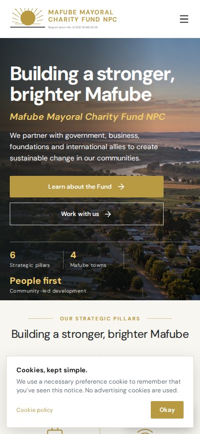 Mafube Mayoral Charity Fund website with gold branding, a river landscape and six community development pillars on mobile