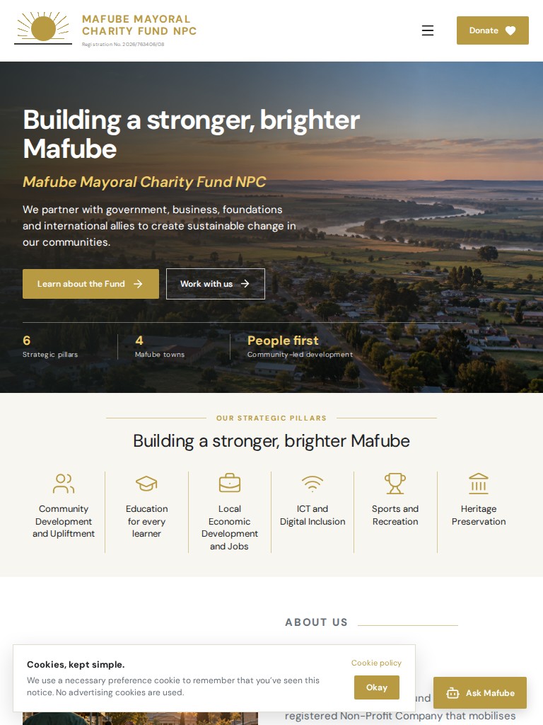 Mafube Mayoral Charity Fund website with gold branding, a river landscape and six community development pillars on tablet